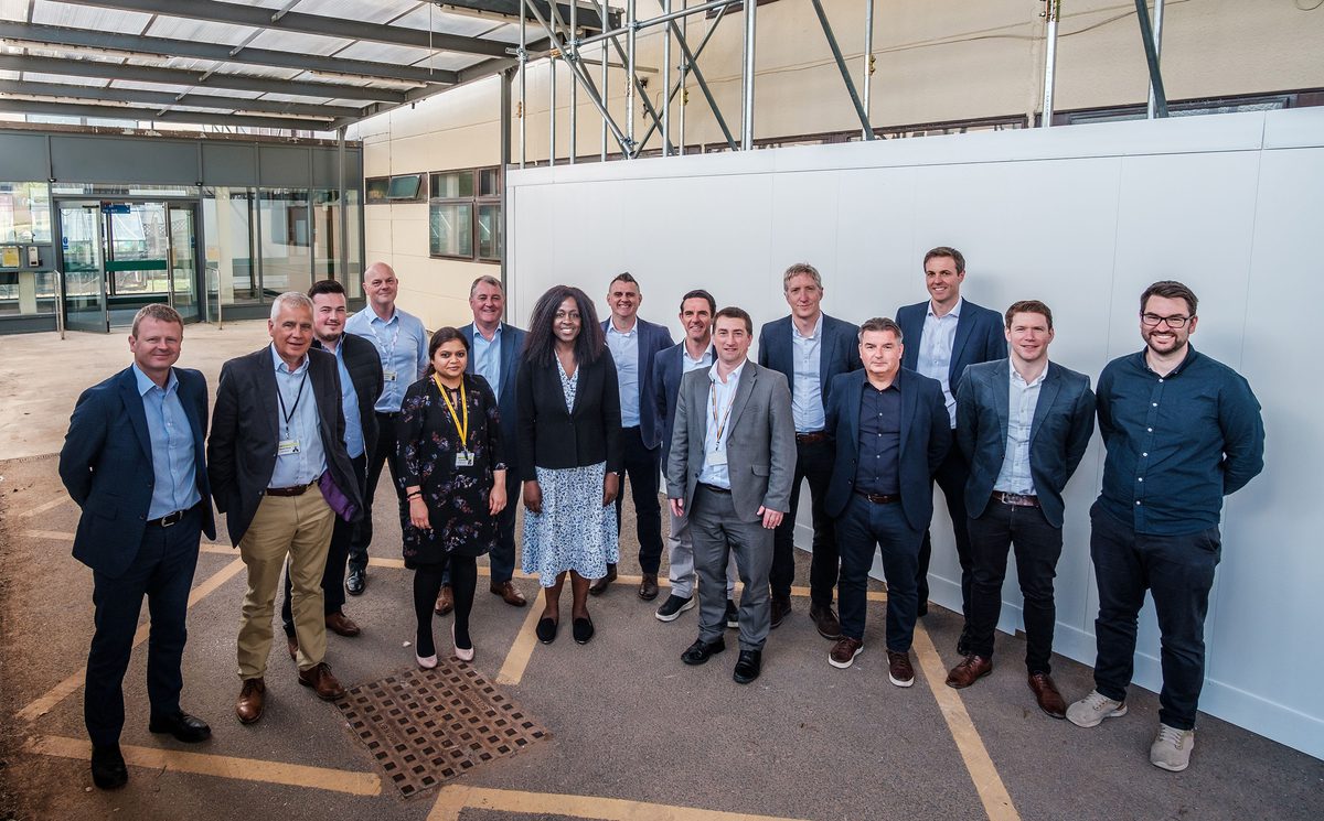 A group photo of the smiling project design team selected to reimagine Airedale General Hospital.