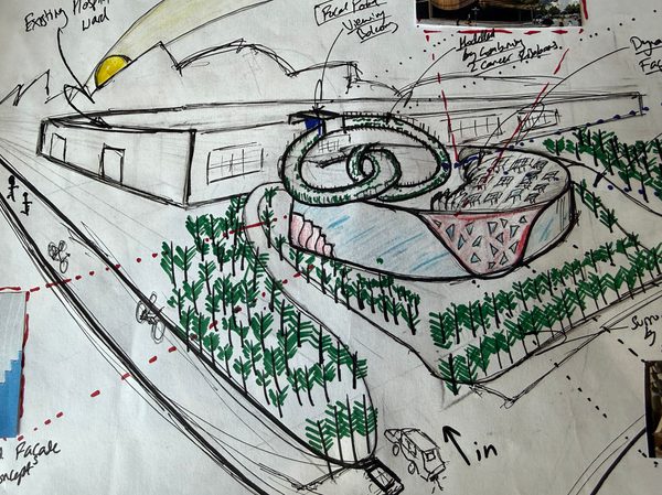 A close up of a colourful sketch drawing of a proposed healthcare building and surrounding landscape.