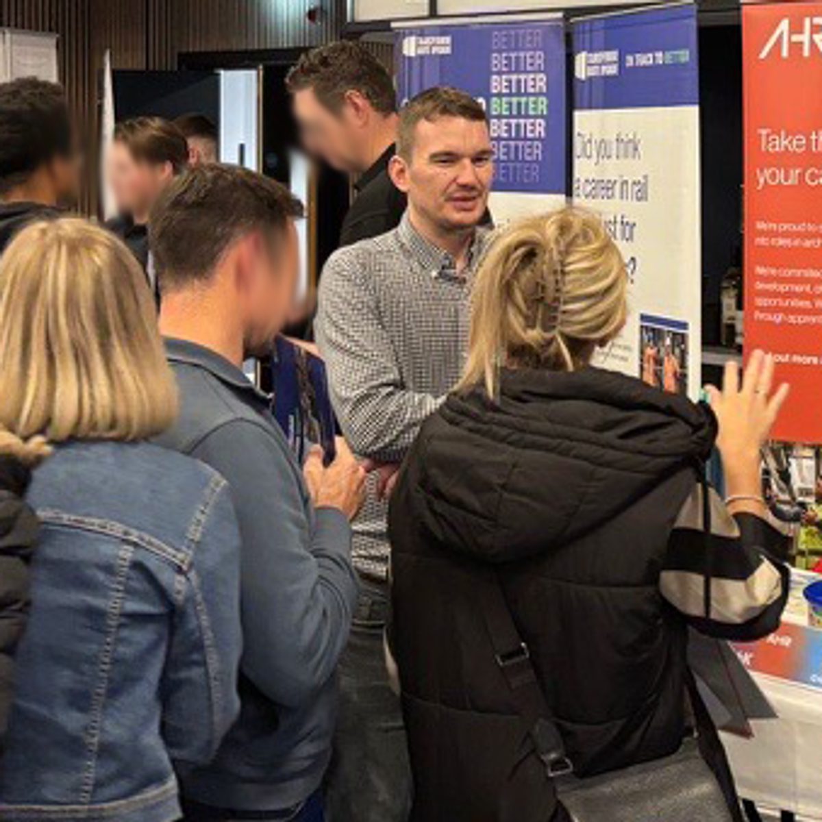 One of our building consultants speaking with students and families at a local careers fair, helping to guide their first career steps into the profession.