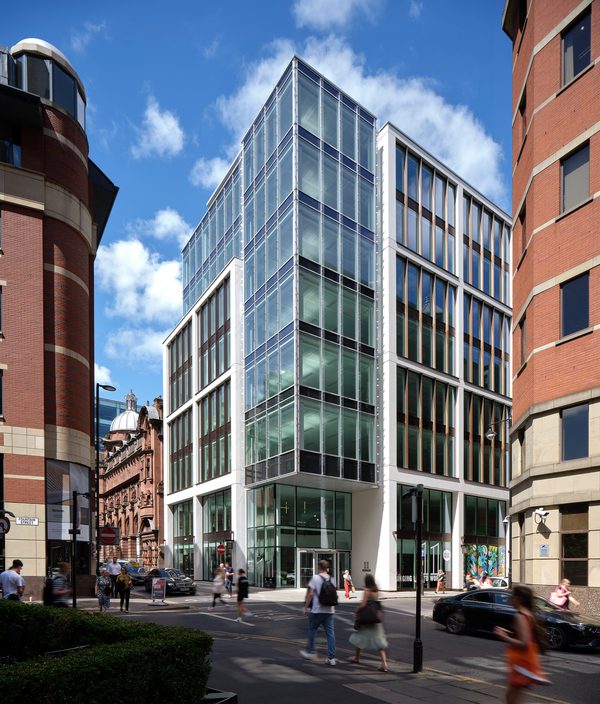 The distinct exterior of the workplace at 11 York Street, showing it's central position, the ground level corner entrance and high levels of glazing throughout.