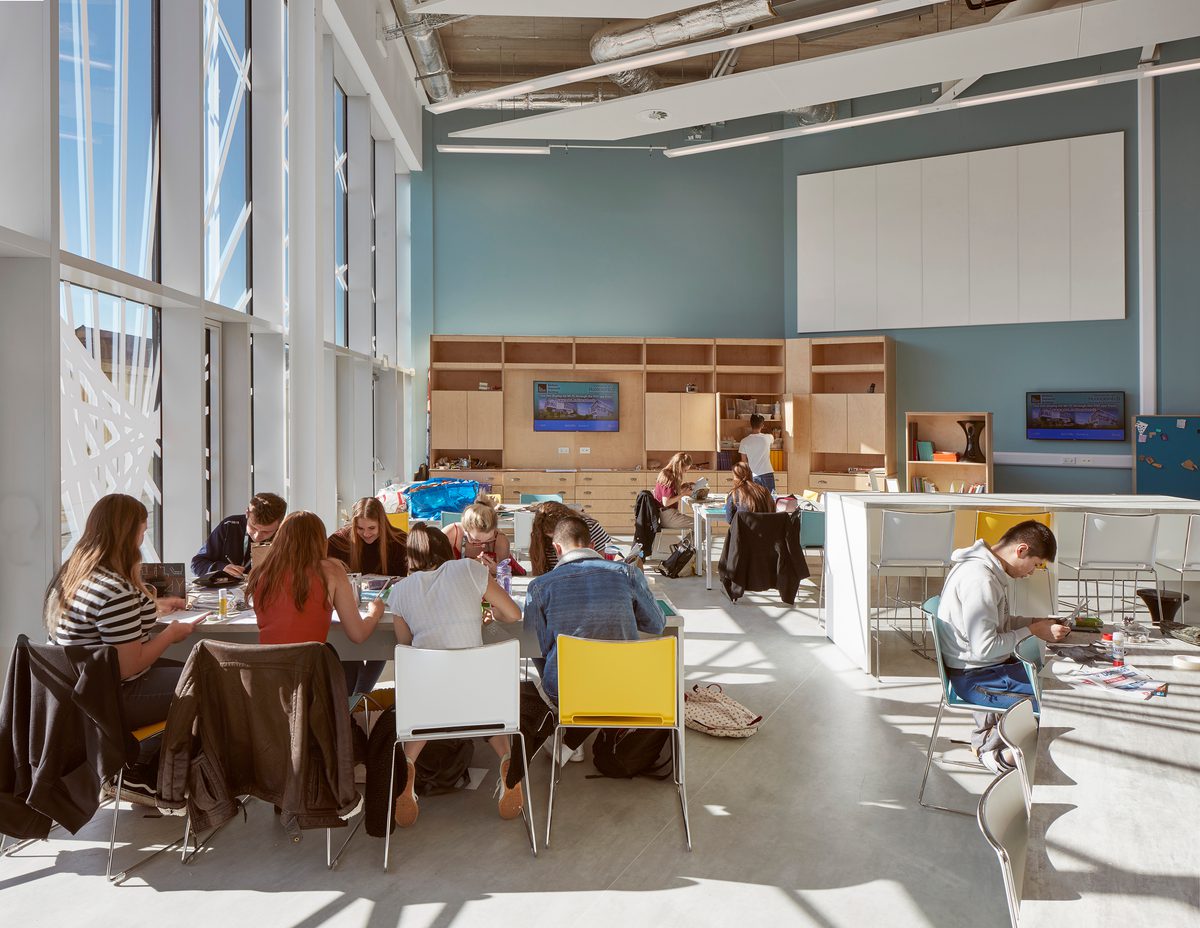 Flexible learning space of the Barbara Hepworth Building showing a range of seating and floor to ceiling windows.