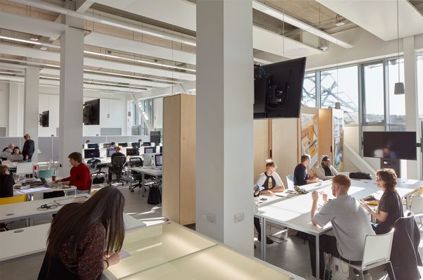 Collaborative breakout space in the Barbara Hepworth Building with students undertaking work.