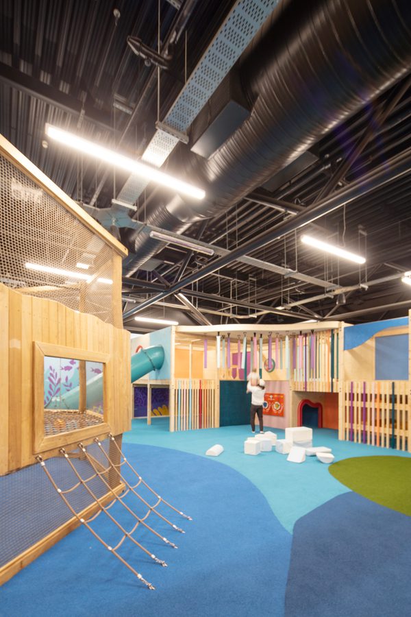 The wooden playing frames and soft carpets as part of the play area inside Barnsley Metrodome Adventure Reef.