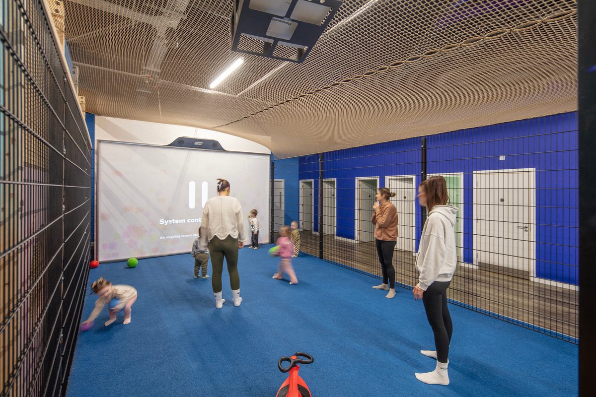 A separate room inside the Adventure Reef with adults and children playing.