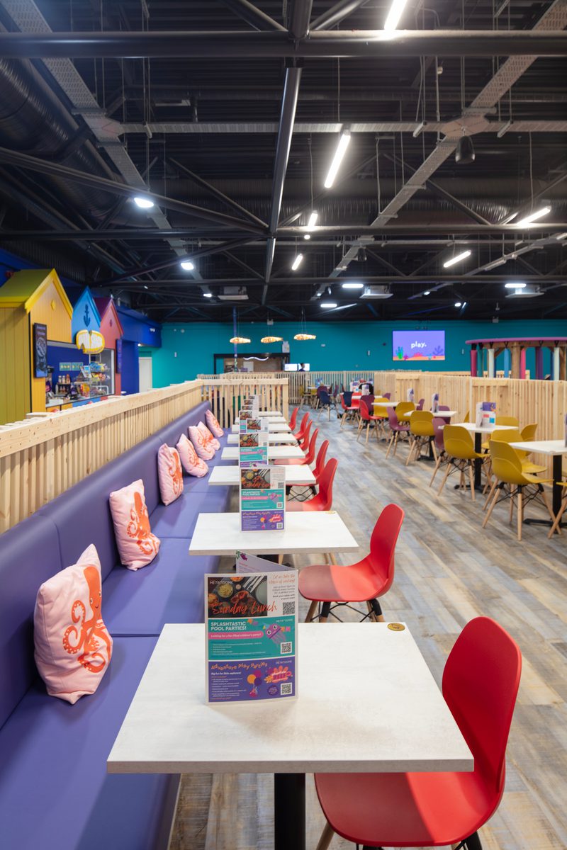 Colourful seating area inside the Barnsley Metrodome Adventure Reef with comfy sofas and seats for eating and relaxing.