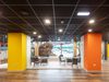 The bright reception area within the refurbished Barnsley Metrodome, with coloured columns and floor to ceiling windows providing views onto the swimming area.