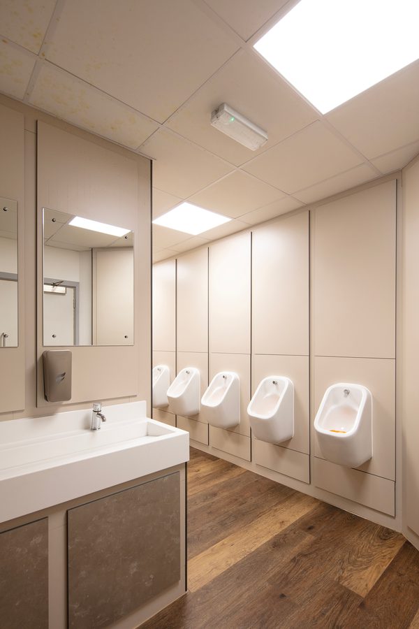 The modern, bright toilet facilities within the refurbished Barnsley Metrodome reception, with wooden flooring.