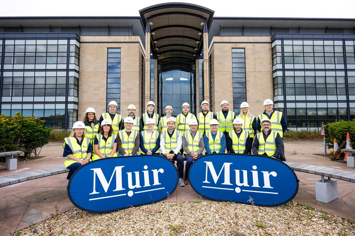 A group in high-vis jackets stood outside the former Younger Building in Edinburgh as works commence to refurbish the building.