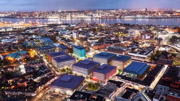 An aerial visualisation showing the scale of the complete Birkenhead Commercial District masterplan and its city centre location at night.