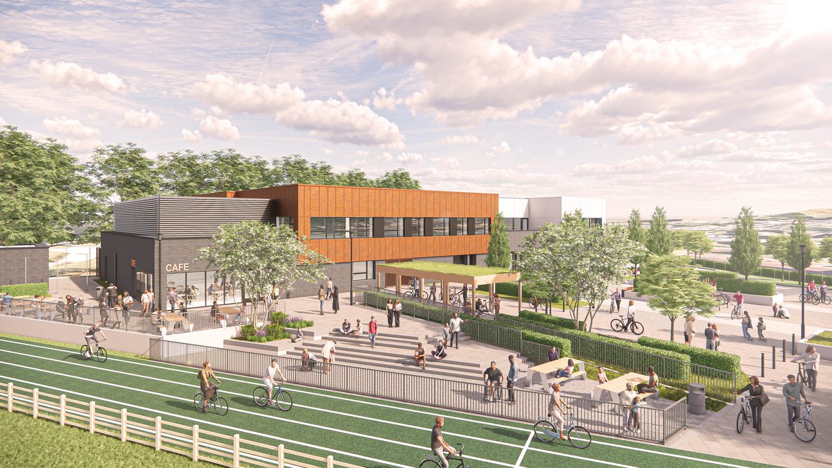 A visualisation of Bristol's new regional cycling hub with a large track looping around the site of the two-storey hub with community members enjoying the space in the foreground.