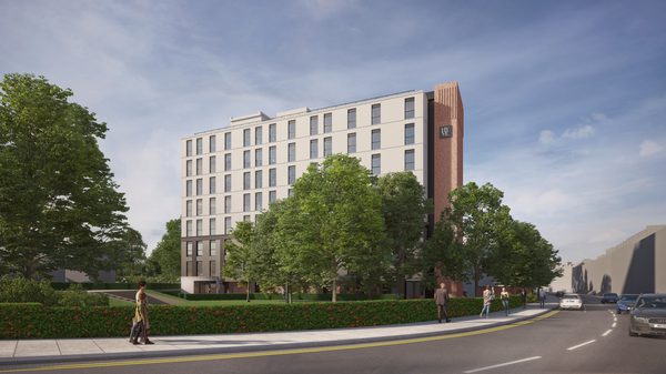 An external visualisation of the former council office block building being redesigned for key worker accommodation with trees and and greenery in the foreground outside.