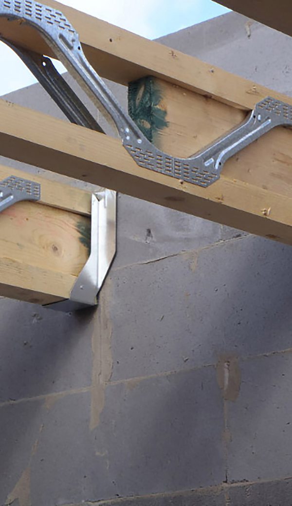 A detail shot of a wooden joist hanger, within one of the houses under construction in the Cameron Close residential development.