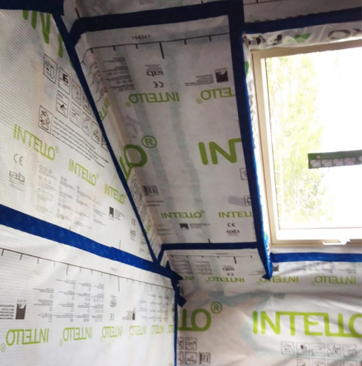A detail shot of the roof space within one of the houses under construction in the Cameron Close residential development, with roof light and insulation panels.