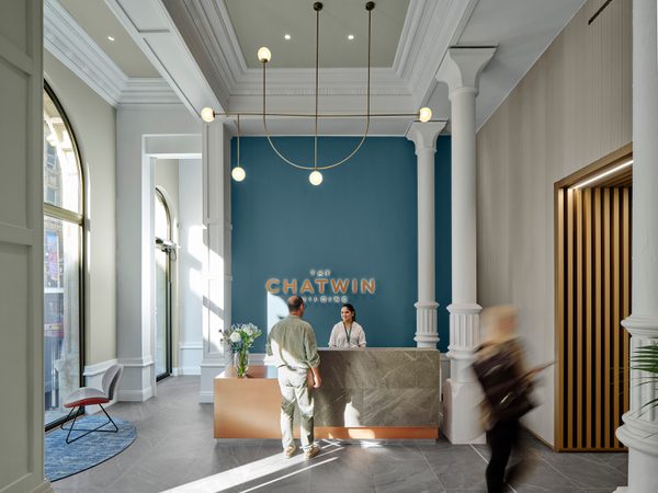 Reception area at the Chatwin Building showing high ceilings, original windows and contemporary interior finishes.