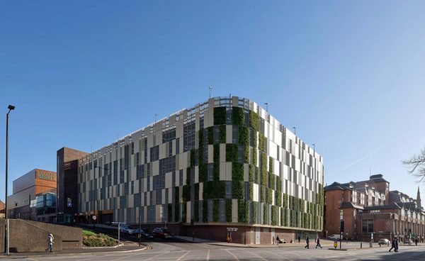 The exterior of the multi-storey carpark at Chester Northgate, stands out with a living green wall curving around the roadside corner.