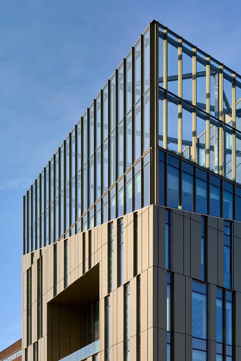 An external view of the top of the Daphne Steele Building from below, showing its dynamic design.
