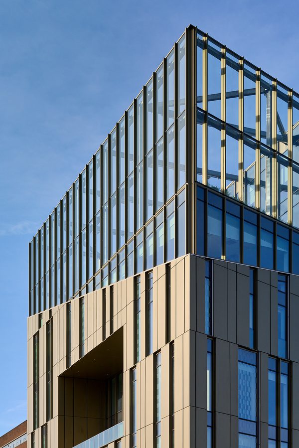 An external view of the top of the Daphne Steele Building from below, showing its dynamic design.
