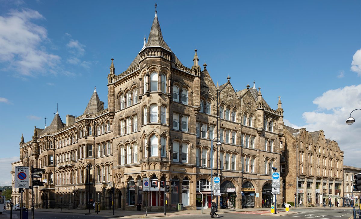 The ornate exterior of a historic Italianate Gothic, Grade II* Listed building within Huddersfield city centre.