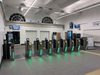 A row of electronic gates allowing passengers through to the main station at Exeter Central Station.