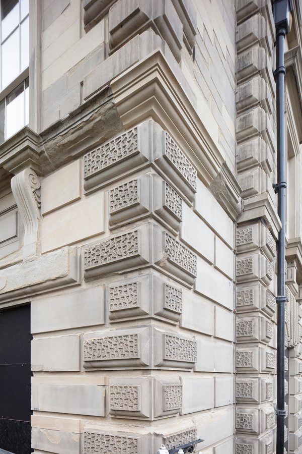 A detail shot of the restored exterior stone cornering of the Grade II listed George Hotel.