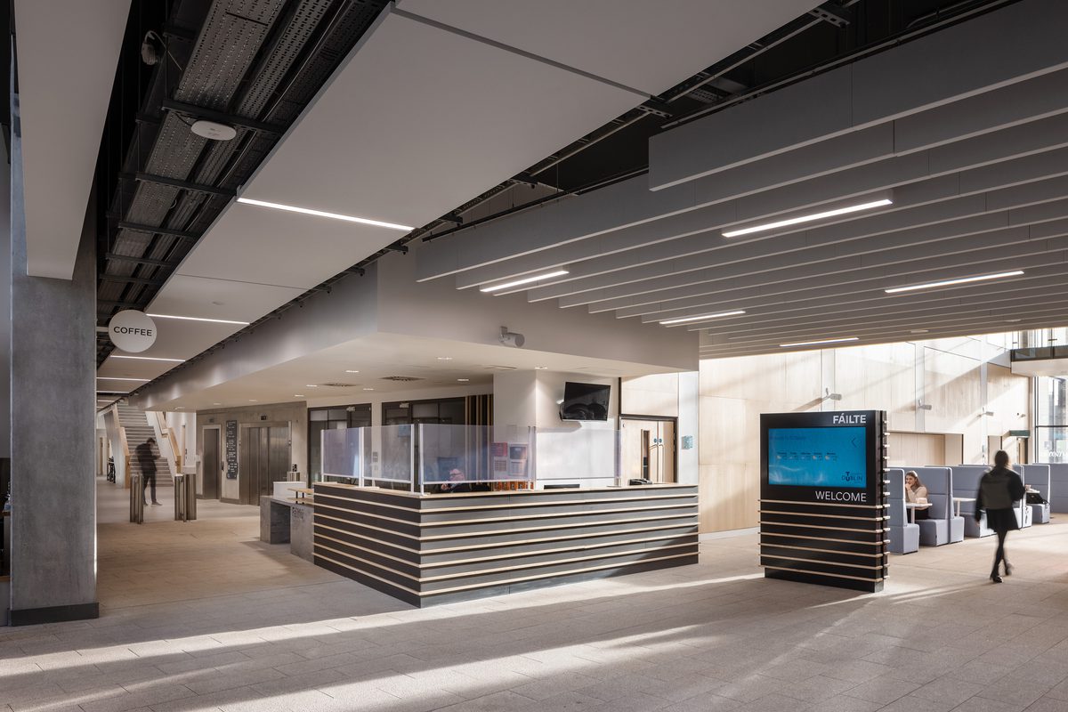 East Quad Building entrance space showing natural light, clear wayfinding with people moving through the space and on reception.