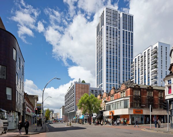 A visualisation of the high rise tower block in Ilford town centre with an active street in the foreground.