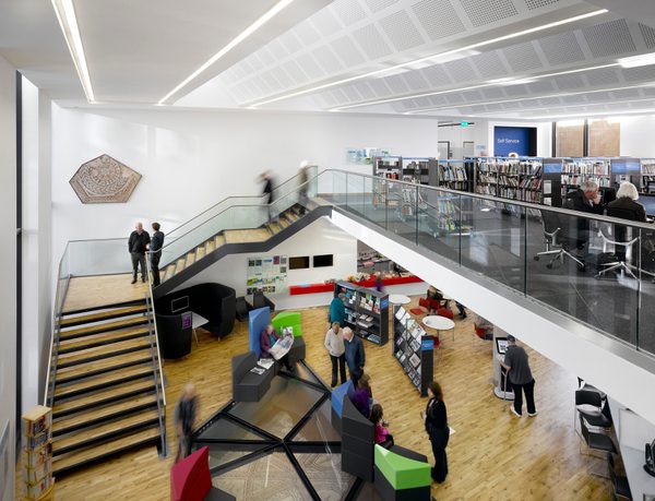 The library within Keynsham Civic Centre and One-Stop-Shop, with mezzanine level and historic Roman mosaic incorporated into the floor.