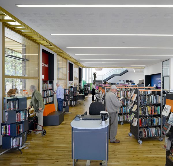 People using the library space within Keynsham Civic Centre and One-Stop-Shop.