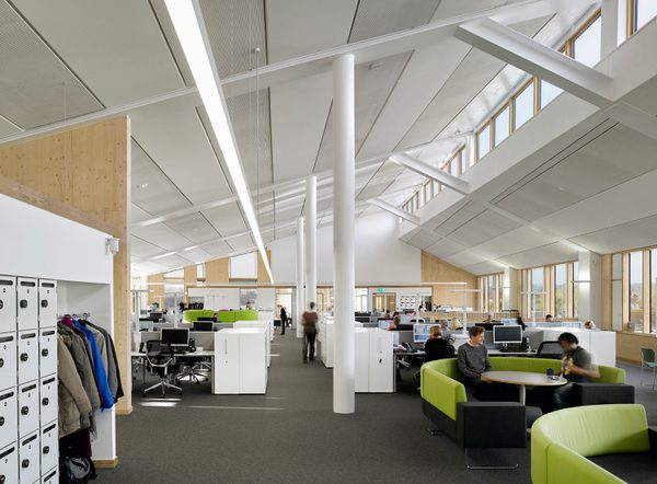 The varied workspaces in the council offices within Keynsham Civic Centre and One-Stop-Shop, with gabled ceiling above.