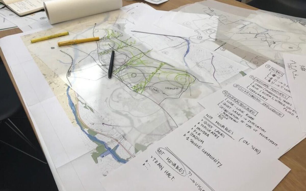 A table with marked maps on, used in the stakeholder engagement process for planning Langarth Garden Village.