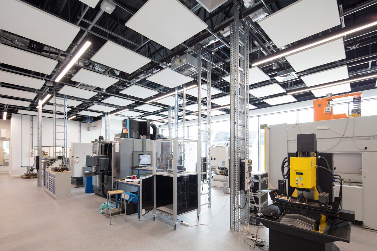 A large, open state of the art facility within the Laura Annie Wilson Building, with technical, specialist engineering equipment and floor to ceiling exterior windows.