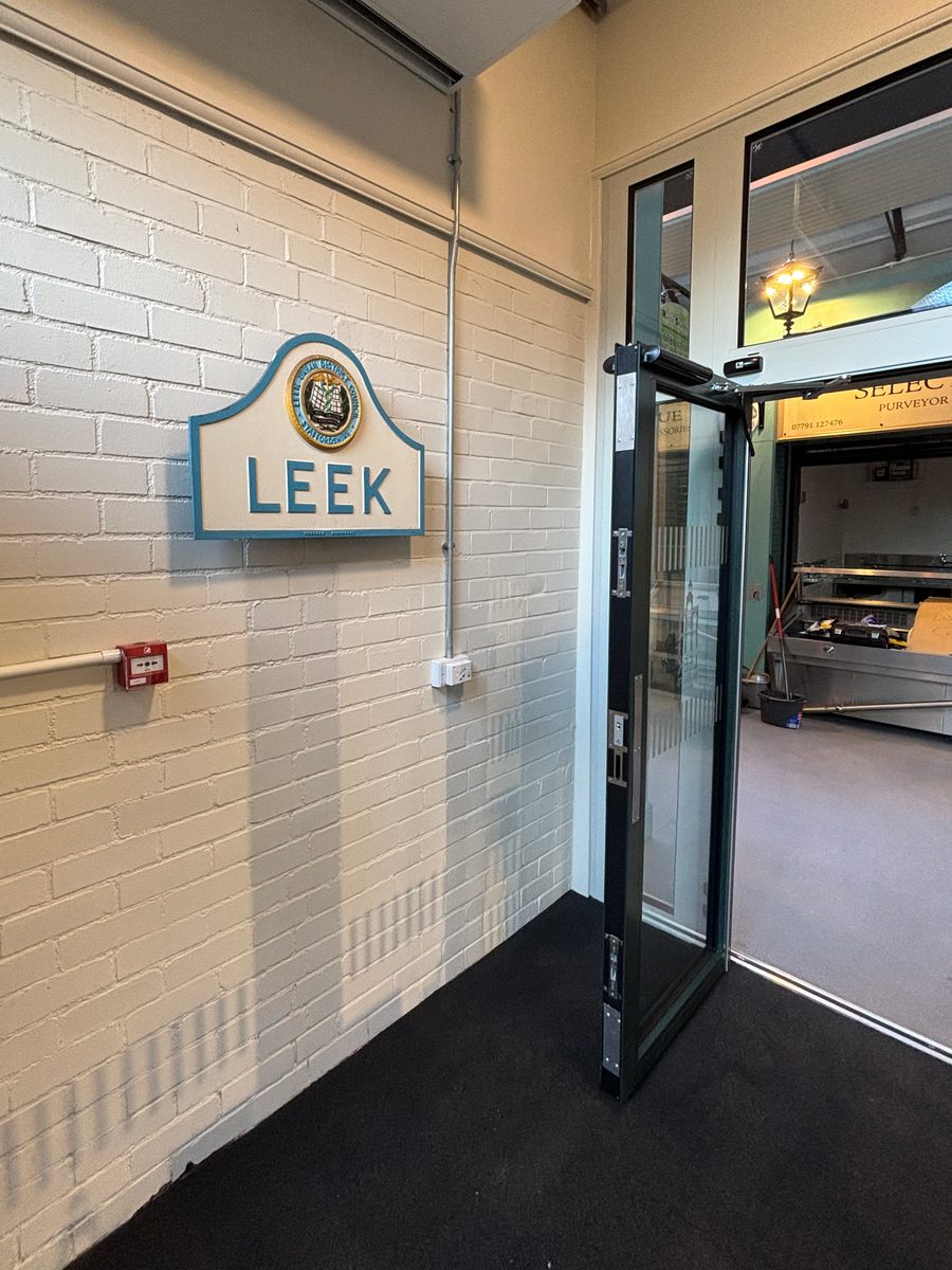 The branded signage on entrance to Leek's indoor market.