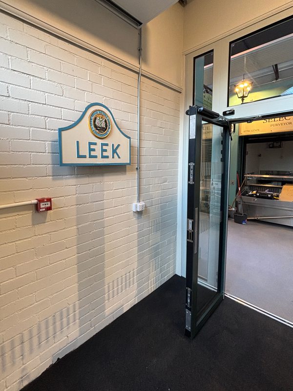 The branded signage on entrance to Leek's indoor market.