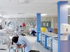 Medical staff working within the neonatal unit at the Leicester Royal infirmary, surrounded by incubators and medical equipment.