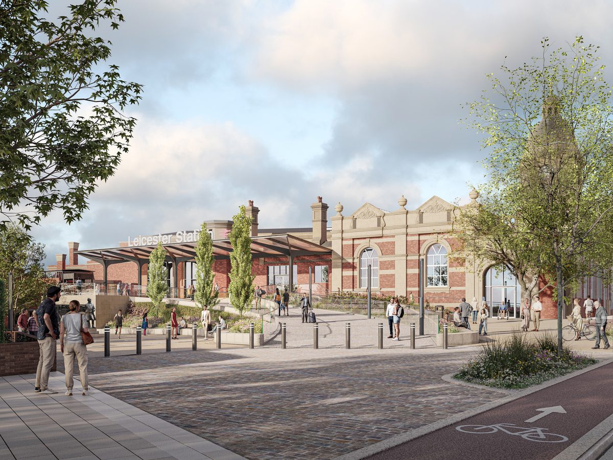 A visualisation with pedestrians in front of the redeveloped Victorian Leicester Station, with landscaped green spaces in front.t.