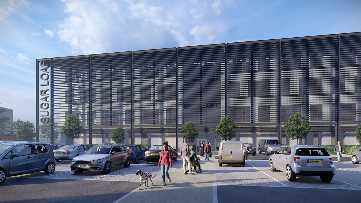 An exterior visualisation of Plot F in Malvern technology park surrounded car parking and pedestrians using the space.