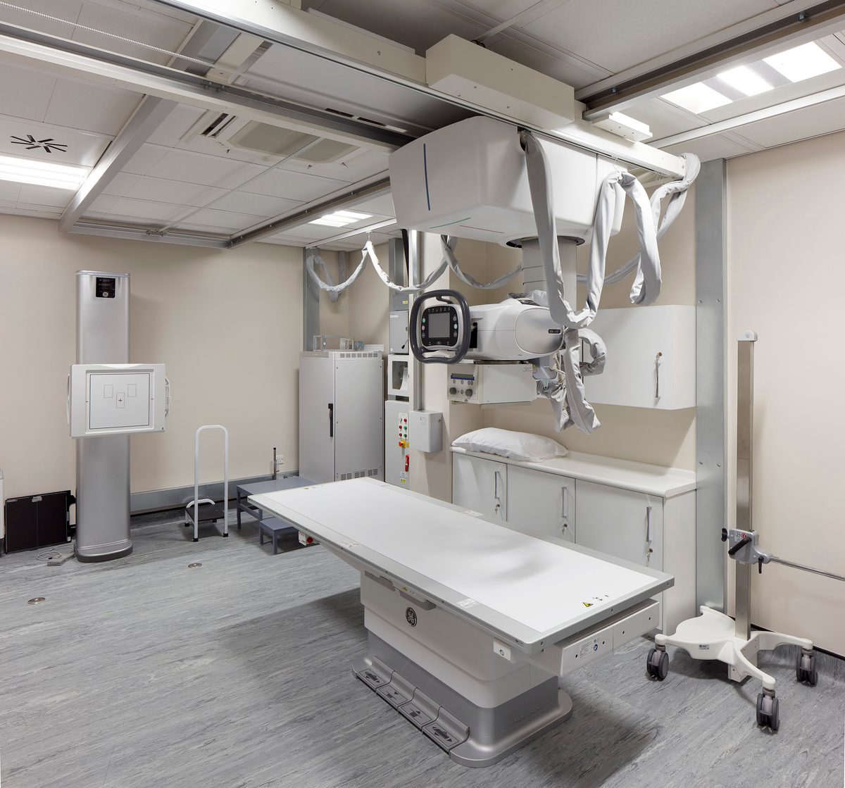 A physiotherapy suite within the Manchester Institute of Health and Performance, with bed and specialist equipment above.