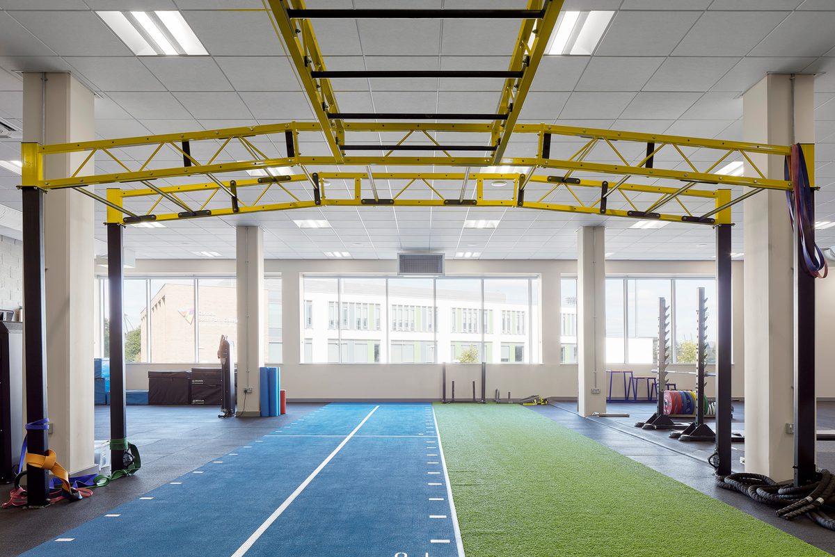 The highly glazed strength and conditioning gym within the Manchester Institute of Health and Performance.