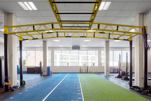 The highly glazed strength and conditioning gym within the Manchester Institute of Health and Performance.