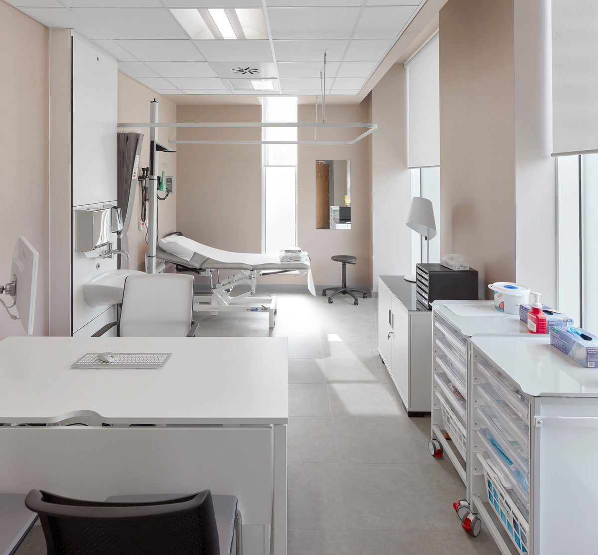 A consultation room within the Manchester Institute of Health and Performance, with medical facilities.