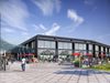 A visualisation of the external view of Northwich Market with an outdoor canopy and seating in the foregound.