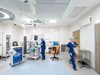 A live operating theatre inside the Princess Royal Hospital Day Case Elective Hub with hospital colleagues moving around the space.