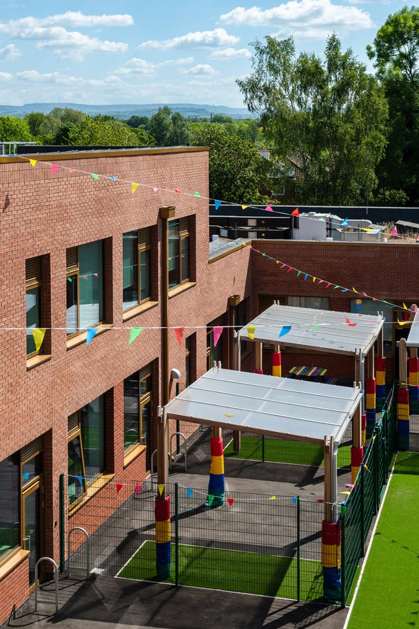 A portrait external shot looking down on the outdoor space and canopies.