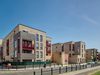 Street-level view of Peterhead Court illustrating the building's integration within the local area.