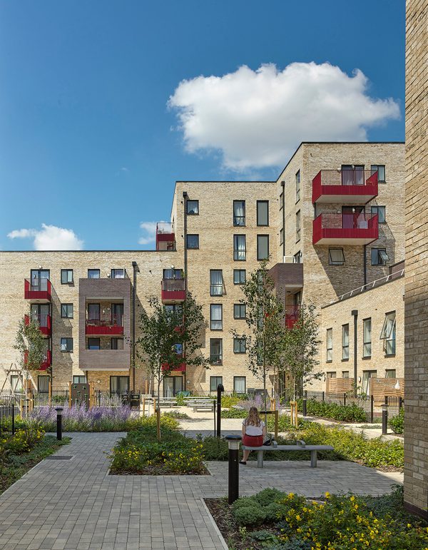 Landscaped communal courtyard at Peterhead Court featuring paved walkways and integrated planters.