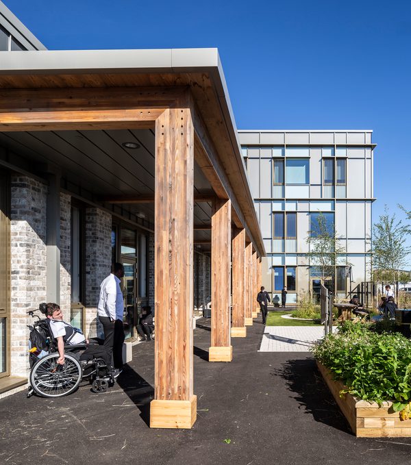 The communal outdoor space of Woodmill and St Columba's RC High School, with sheltered areas and landscaped planting.