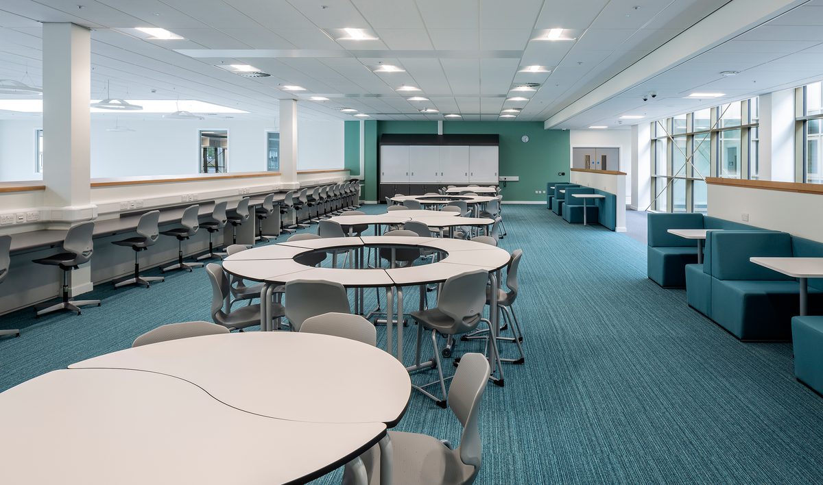 A classroom within the Woodmill and St Columba's RC High School, with a variety of different workspaces.