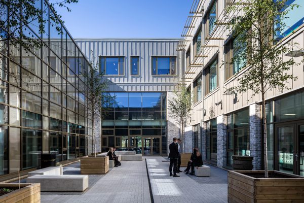 Pupils enjoying the outdoor space within the shared central courtyard within the Woodmill and St Columba's RC High School.