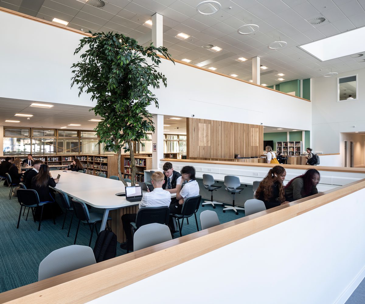 Pupils working collaboratively in the shared library space of of Woodmill and St Columba's RC High School.