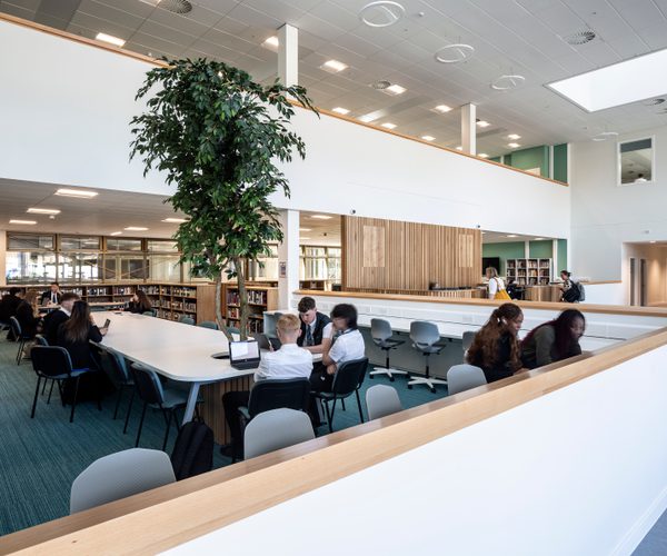 Pupils working collaboratively in the shared library space of of Woodmill and St Columba's RC High School.